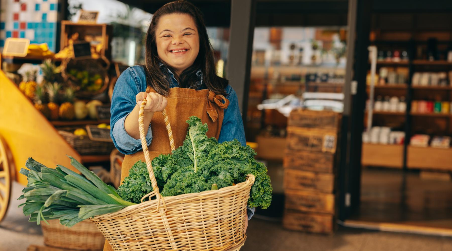Woman with down syndrome in holding groceries