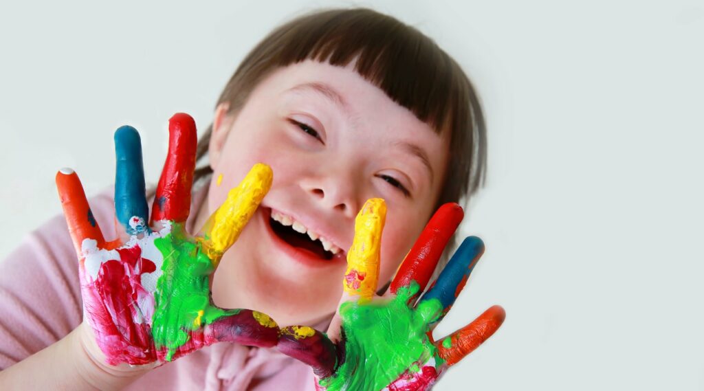 Little girl with painted hands